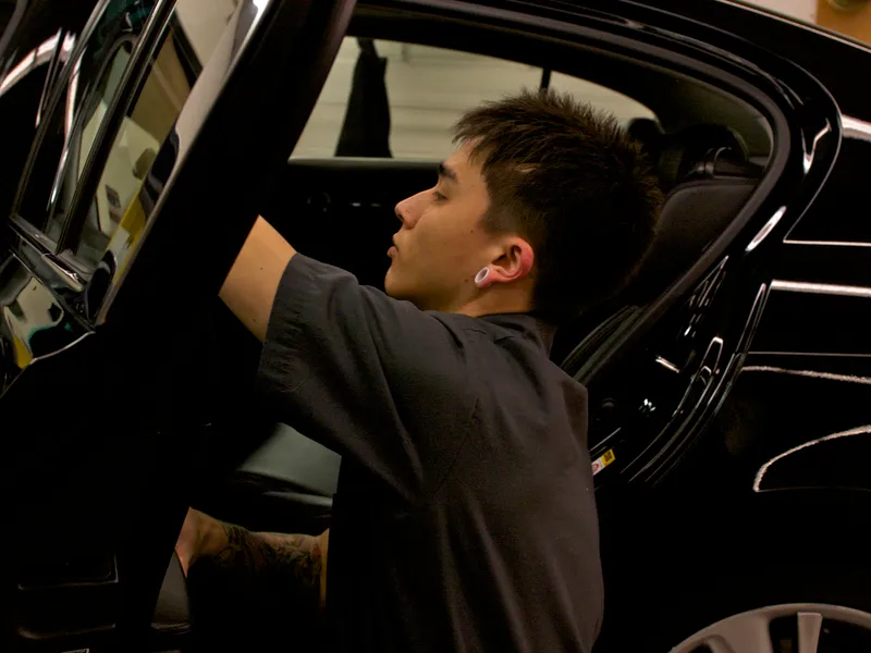 Technician preparing a vehicle for service