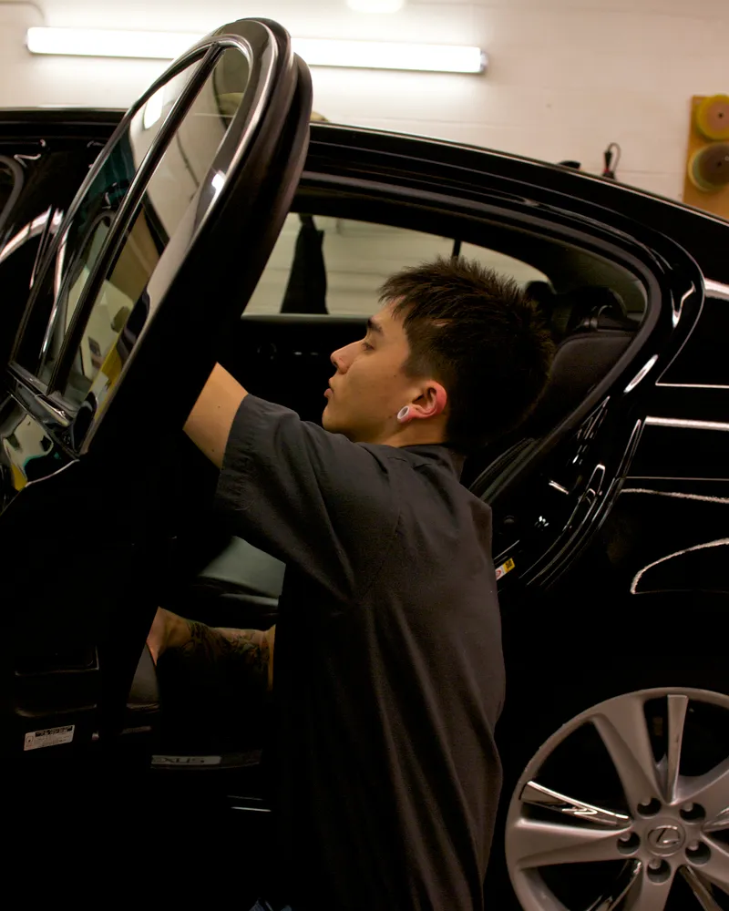 Technician preparing a vehicle for service