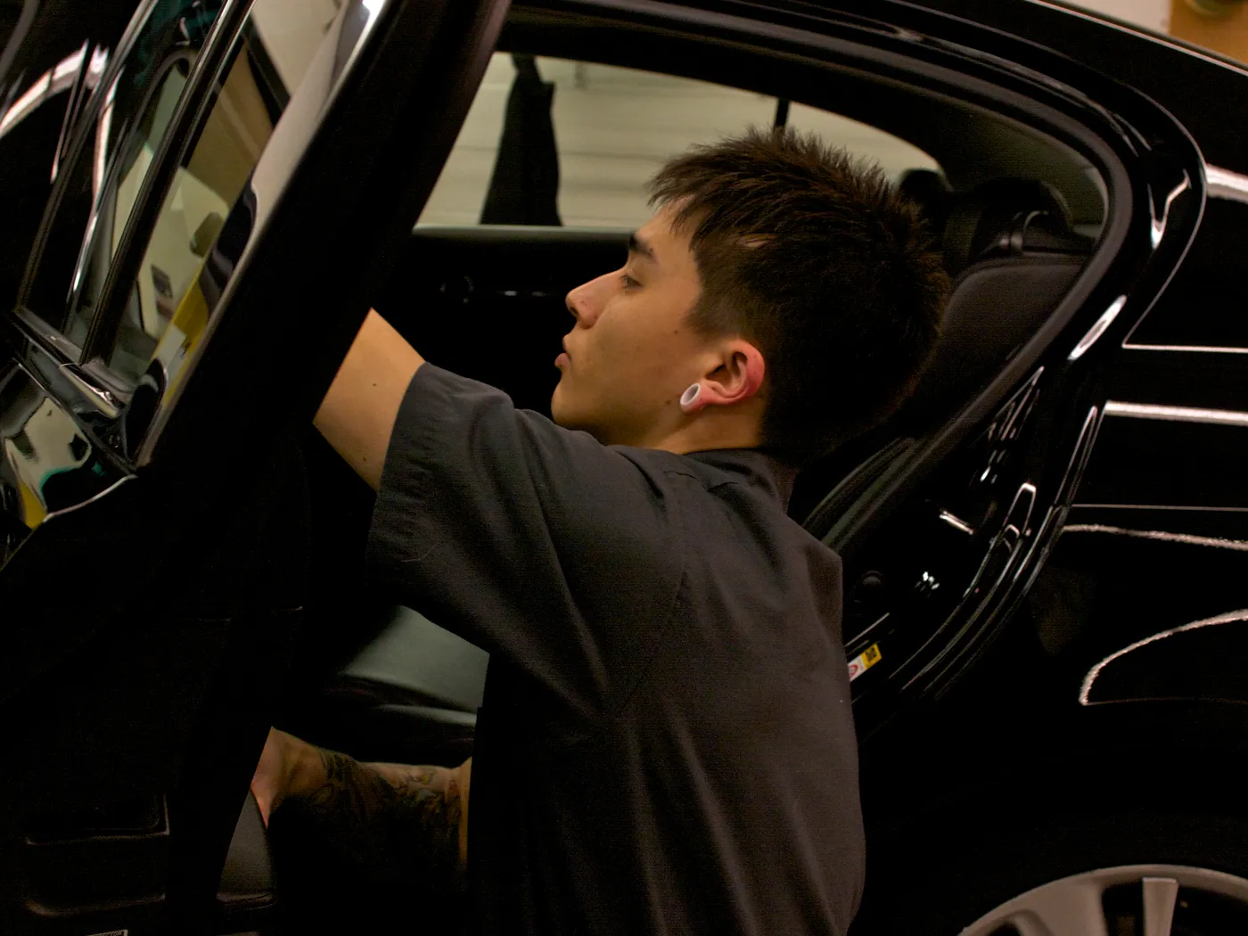 Technician preparing a vehicle for service